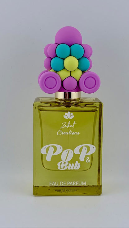 Perfume Pop & Bub de Zakat Creations, Eau de Parfum 50 ml, frasco amarillo verdoso con tapón de burbujas de colores – Siblingsgo Miami