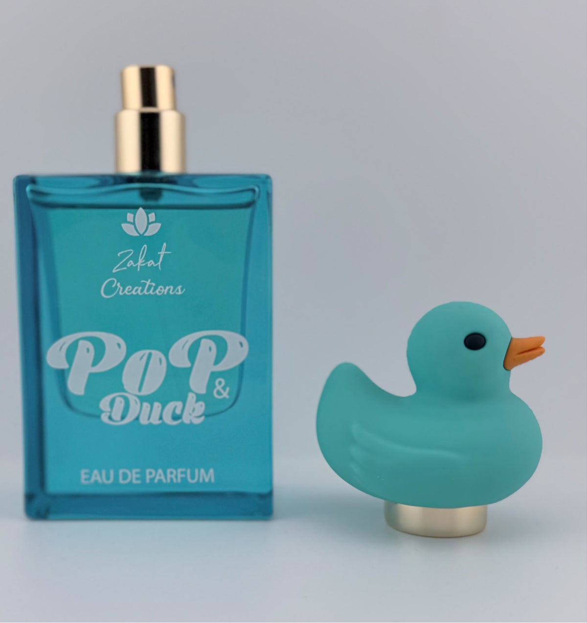 Perfume Pop & Duck de Zakat Creations, Eau de Parfum 50 ml, frasco azul junto a su caja de regalo – Siblingsgo Miami